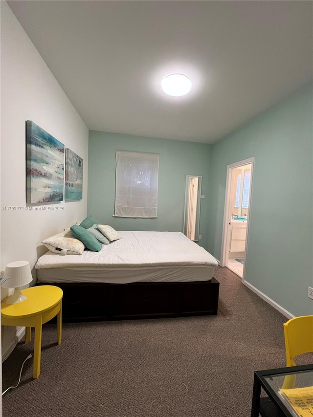1614 Pennsylvania Ave Unit 2I, Miami Beach, FL 33139 - bedroom featuring carpet flooring, ensuite bath, and baseboards