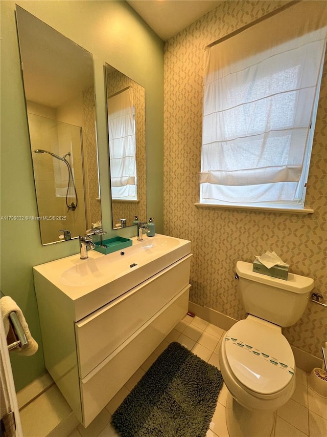 1614 Pennsylvania Ave Unit 2I, Miami Beach, FL 33139 - bathroom featuring healthy amount of natural light, tile patterned flooring, toilet, a shower, and wallpapered walls