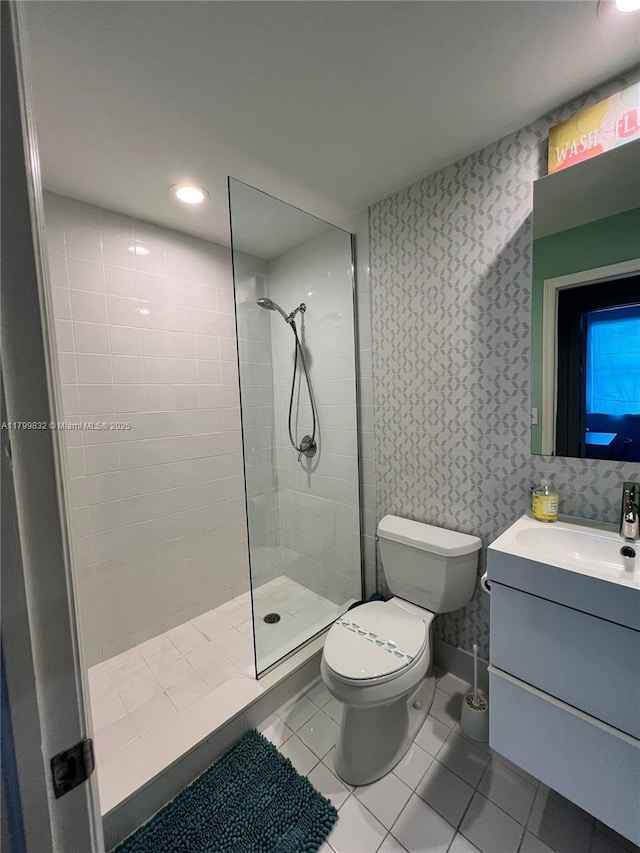 1614 Pennsylvania Ave Unit 2I, Miami Beach, FL 33139 - bathroom featuring walk in shower, toilet, tile patterned floors, vanity, and recessed lighting