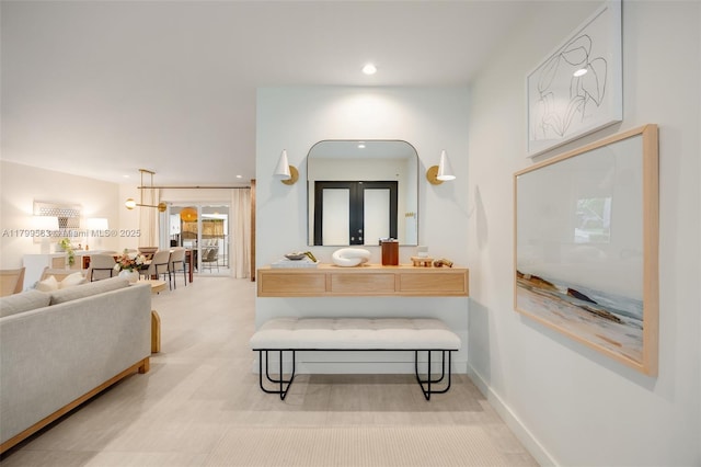 bathroom featuring french doors, recessed lighting, and vanity