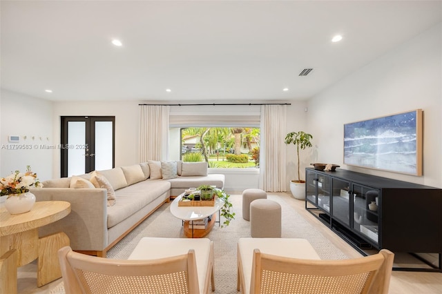 living room featuring recessed lighting and french doors