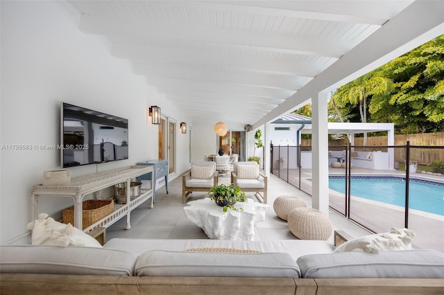view of patio with an outdoor living space and fence
