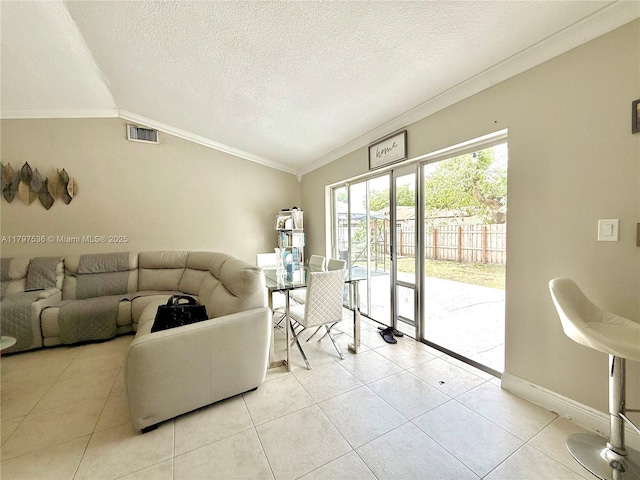 5730 NW 199th St, Hialeah, FL 33015 - living area with lofted ceiling, light tile patterned floors, crown molding, a textured ceiling, and baseboards