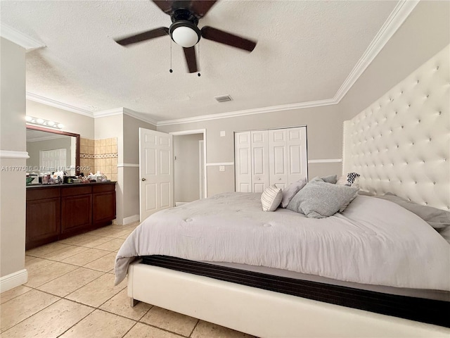 5730 NW 199th St, Hialeah, FL 33015 - bedroom featuring crown molding, a textured ceiling, light tile patterned flooring, ensuite bath, and a ceiling fan