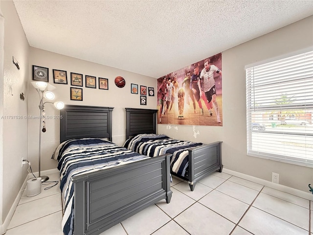 5730 NW 199th St, Hialeah, FL 33015 - bedroom featuring a textured ceiling, light tile patterned floors, and baseboards