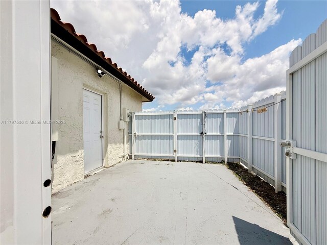 5730 NW 199th St, Hialeah, FL 33015 - view of patio / terrace with fence