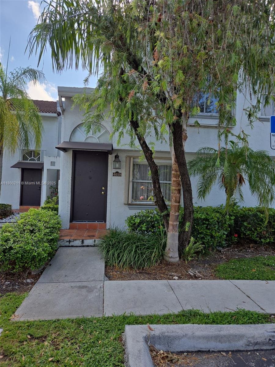 4659 NW 97th Ct Unit 35, Doral, FL 33178 - view of front of house with stucco siding and a tile roof