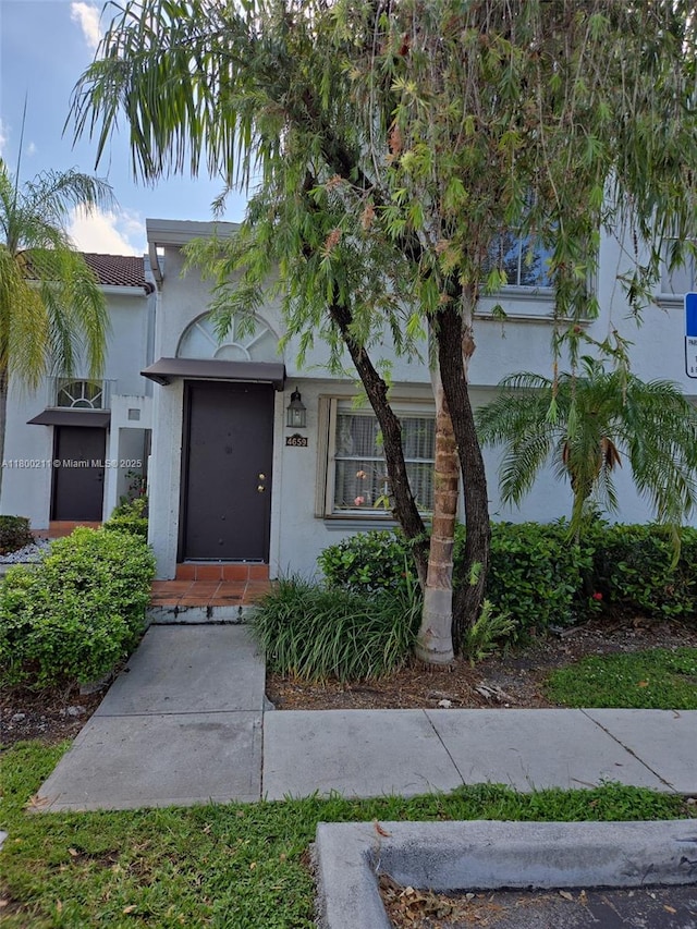 4659 NW 97th Ct Unit 35, Doral, FL 33178 - view of front of house with stucco siding and a tile roof