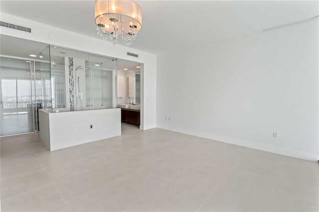 1040 Biscayne Blvd Unit 3802, Miami, FL 33132 - unfurnished room with a chandelier