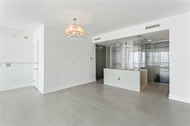 1040 Biscayne Blvd Unit 3802, Miami, FL 33132 - empty room with a chandelier and baseboards
