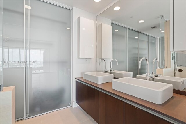 1040 Biscayne Blvd Unit 3802, Miami, FL 33132 - bathroom featuring double vanity and tile patterned flooring