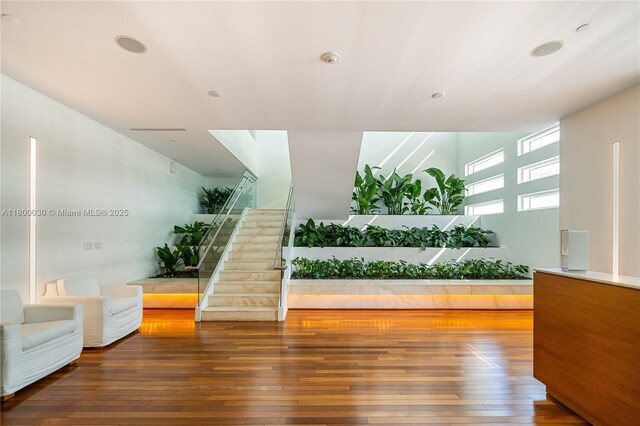 1040 Biscayne Blvd Unit 3802, Miami, FL 33132 - living room with stairs, wood-type flooring, and recessed lighting