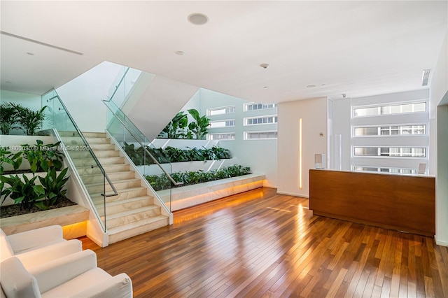 1040 Biscayne Blvd Unit 3802, Miami, FL 33132 - living area with wood-type flooring, stairway, and healthy amount of natural light