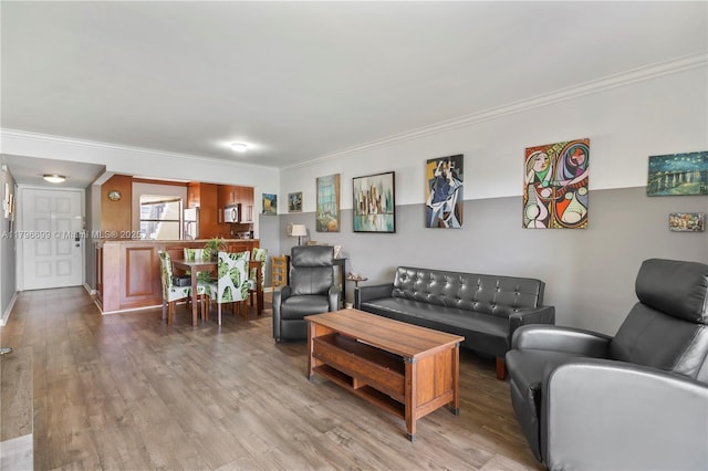 22053 Palms Way Unit 106, Boca Raton, FL 33433 - living area featuring ornamental molding, wood finished floors, and baseboards