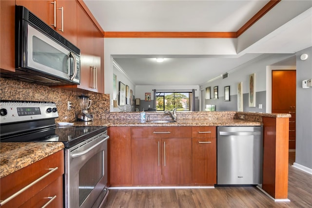 22053 Palms Way Unit 106, Boca Raton, FL 33433 - kitchen with appliances with stainless steel finishes, dark wood finished floors, tasteful backsplash, ornamental molding, and stone counters
