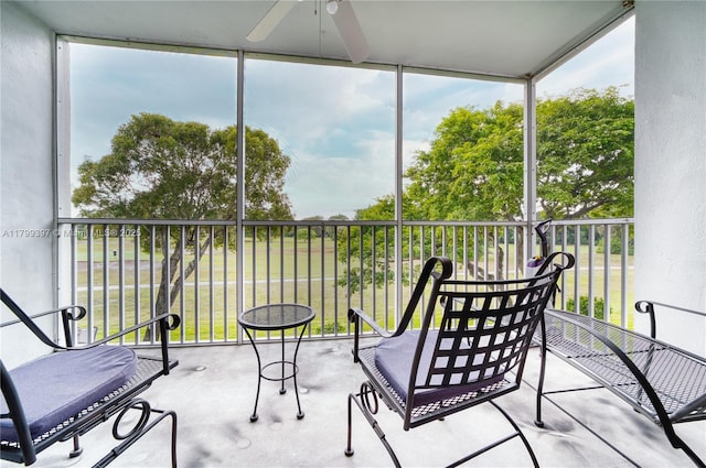 sunroom with a ceiling fan