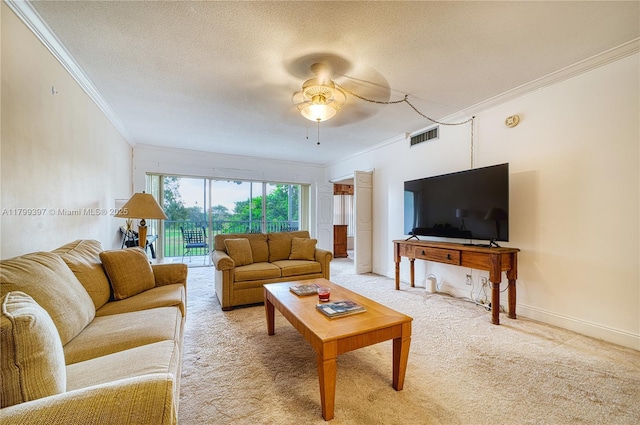 living room with crown molding, light colored carpet, a ceiling fan, baseboards, and a textured ceiling