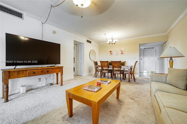 living room featuring crown molding, light colored carpet, a chandelier, a textured ceiling, and baseboards