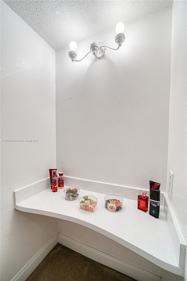bathroom with a textured ceiling