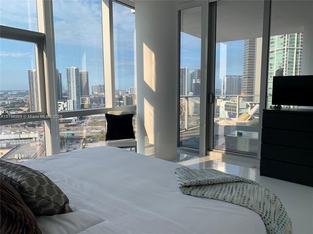 bedroom featuring a wall of windows
