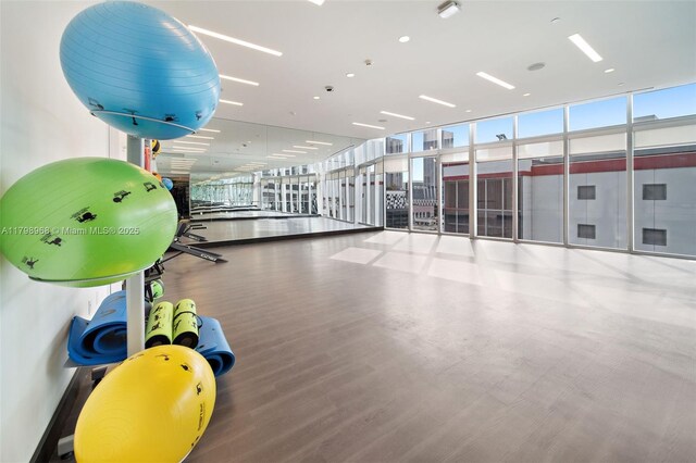 851 NE 1st Ave Unit 1700, Miami, FL 33132 - gym featuring healthy amount of natural light, floor to ceiling windows, and wood finished floors