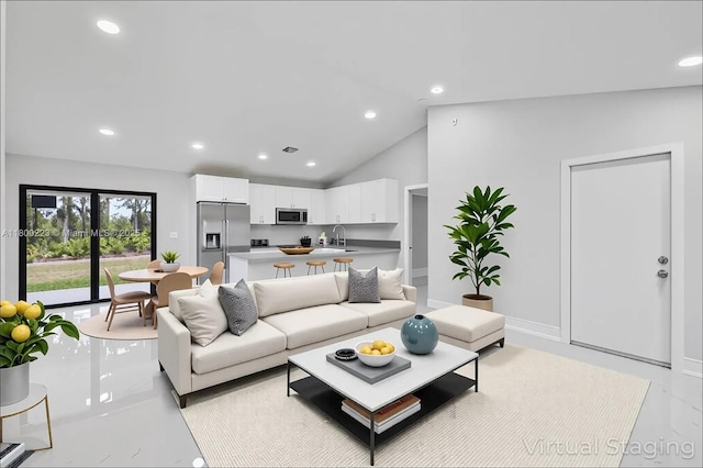 living area with recessed lighting and lofted ceiling