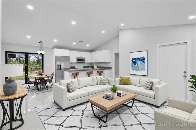 living room with recessed lighting and high vaulted ceiling