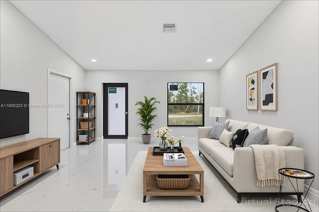 living area with light marble finish floors, recessed lighting, and baseboards