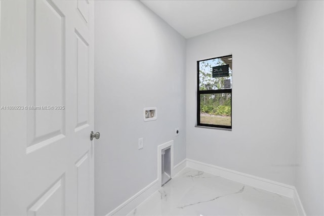 clothes washing area featuring electric dryer hookup, washer hookup, baseboards, and light marble finish floors