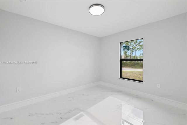 631 S Summit Ave, Lehigh Acres, FL 33974 - empty room with baseboards and marble finish flooring