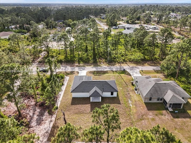 view from above of property featuring a forest