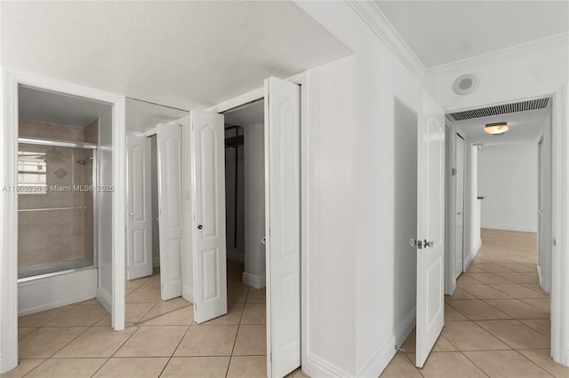 5701 Collins Ave Unit 917, Miami Beach, FL 33140 - hall with light tile patterned flooring, ornamental molding, and baseboards