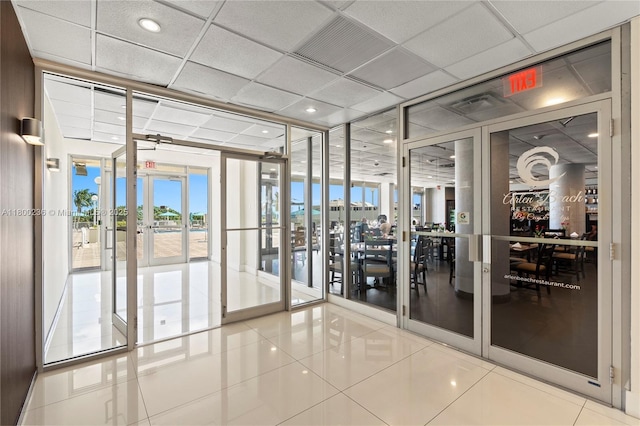 5701 Collins Ave Unit 917, Miami Beach, FL 33140 - building lobby featuring floor to ceiling windows and a water view
