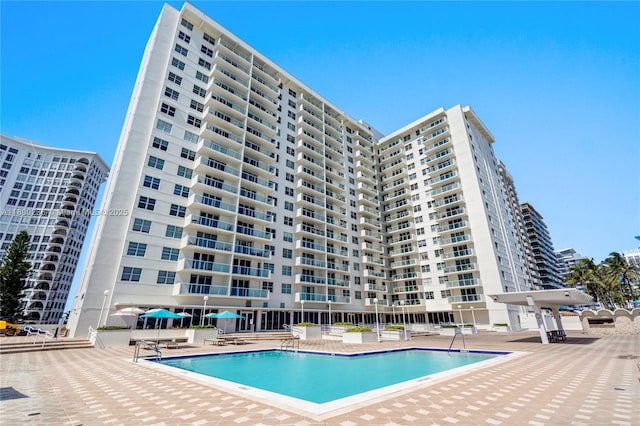 5701 Collins Ave Unit 917, Miami Beach, FL 33140 - community pool featuring a patio