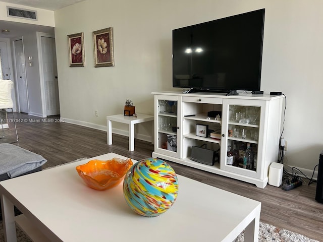 2851 Somerset Dr Unit 307, Lauderdale Lakes, FL 33311 - living room featuring wood finished floors and baseboards
