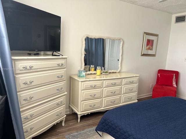 2851 Somerset Dr Unit 307, Lauderdale Lakes, FL 33311 - bedroom featuring dark wood-style floors