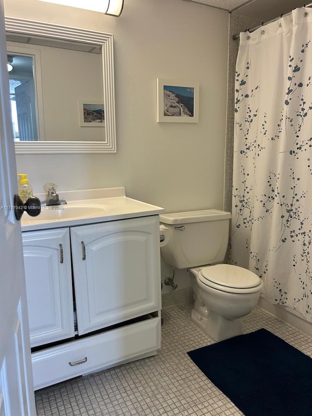 2851 Somerset Dr Unit 307, Lauderdale Lakes, FL 33311 - bathroom with toilet, vanity, and curtained shower