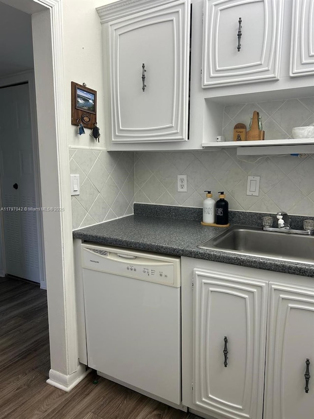2851 Somerset Dr Unit 307, Lauderdale Lakes, FL 33311 - kitchen featuring white dishwasher, a sink, dark countertops, and backsplash