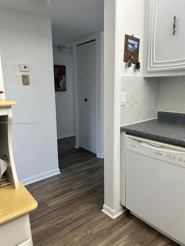 2851 Somerset Dr Unit 307, Lauderdale Lakes, FL 33311 - kitchen with dishwasher, dark wood finished floors, baseboards, backsplash, and white cabinets