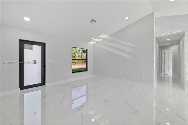 817 Moore Ave, Lehigh Acres, FL 33972 - unfurnished room with recessed lighting, marble finish flooring, and baseboards
