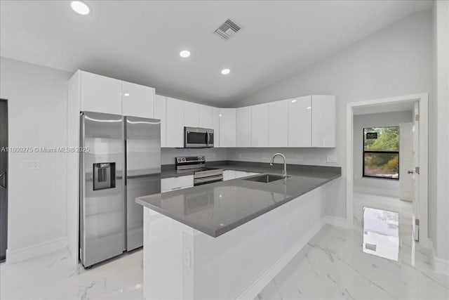 817 Moore Ave, Lehigh Acres, FL 33972 - kitchen featuring stainless steel appliances, a sink, light marble finish flooring, lofted ceiling, and baseboards