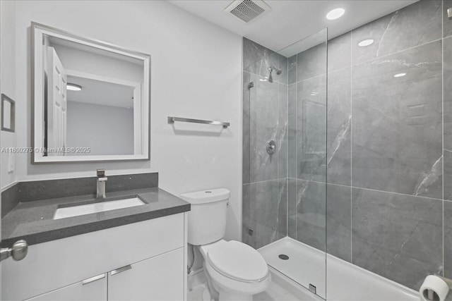 817 Moore Ave, Lehigh Acres, FL 33972 - full bath featuring toilet, a tile shower, and vanity