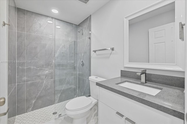 817 Moore Ave, Lehigh Acres, FL 33972 - full bath featuring a shower stall, toilet, vanity, recessed lighting, and marble finish flooring