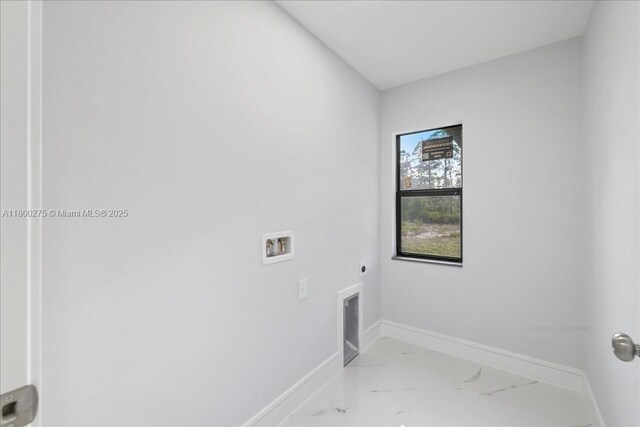 817 Moore Ave, Lehigh Acres, FL 33972 - laundry room featuring electric dryer hookup, washer hookup, marble finish floors, and baseboards