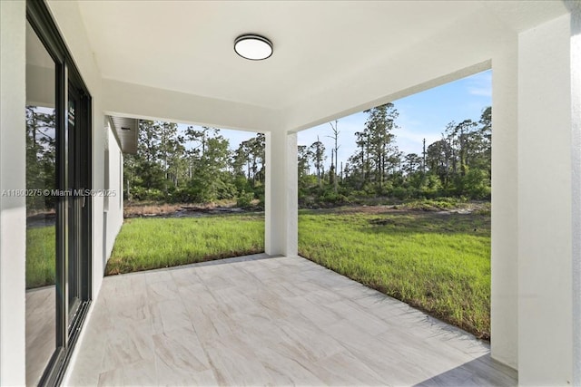 817 Moore Ave, Lehigh Acres, FL 33972 - view of patio / terrace with view of wooded area