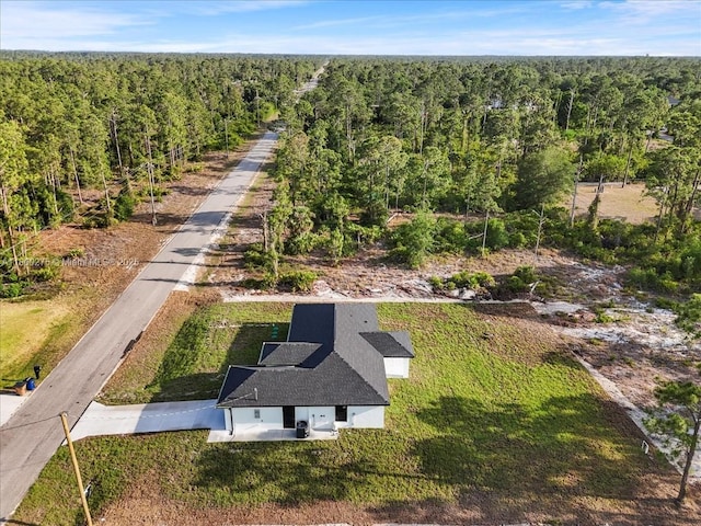 817 Moore Ave, Lehigh Acres, FL 33972 - aerial view of property and surrounding area with a heavily wooded area