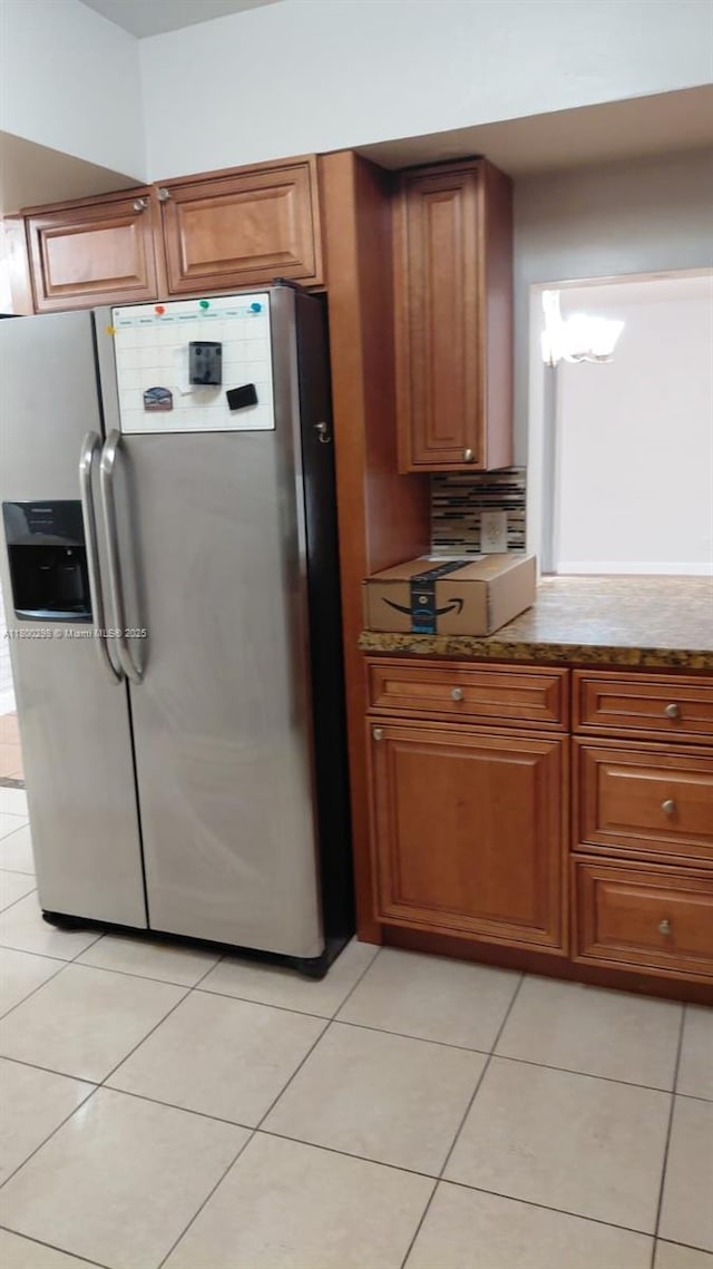 2520 Van Buren St Unit 7, Hollywood, FL 33020 - kitchen with stainless steel fridge with ice dispenser, brown cabinetry, and light tile patterned floors