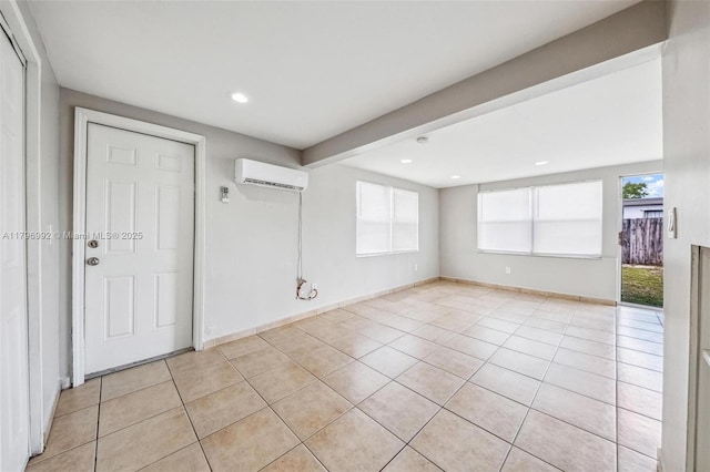 5720 SW 40th Ct, West Park, FL 33023 - empty room featuring an AC wall unit, light tile patterned floors, recessed lighting, and baseboards