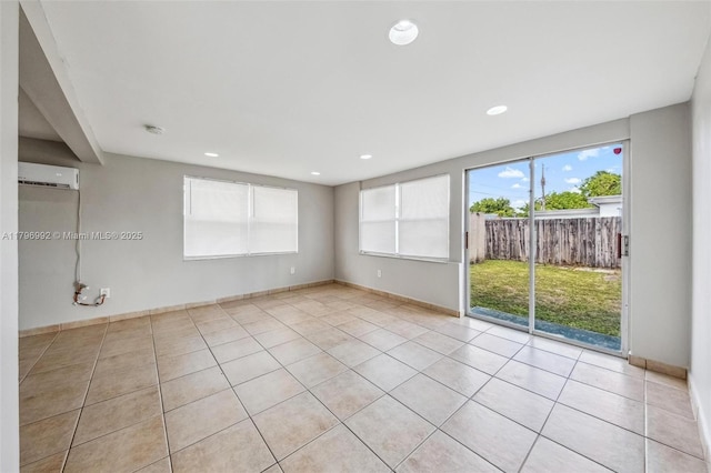 5720 SW 40th Ct, West Park, FL 33023 - spare room featuring an AC wall unit, light tile patterned floors, recessed lighting, and baseboards