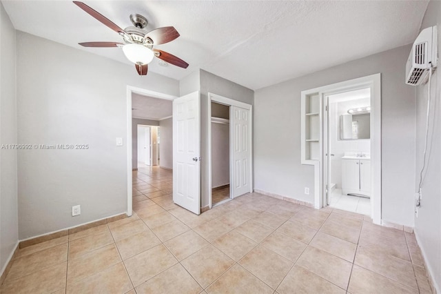 5720 SW 40th Ct, West Park, FL 33023 - unfurnished bedroom featuring light tile patterned flooring, a closet, baseboards, ensuite bathroom, and ceiling fan